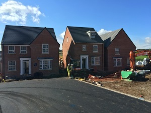 builders cleaning construction site